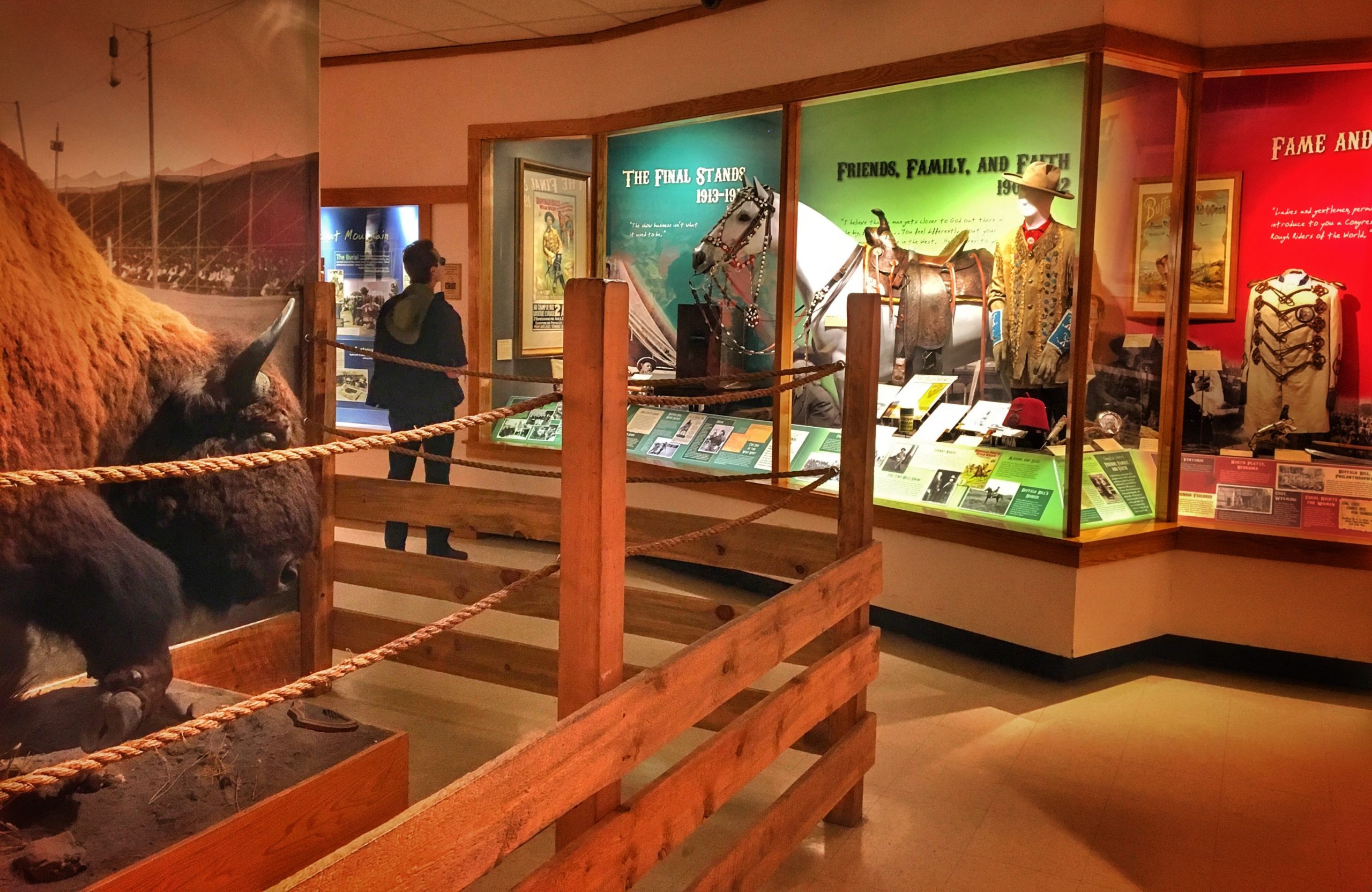 Adult man viewing an indoor exhibit in the Buffalo Bill Museum in Golden, Colorado.