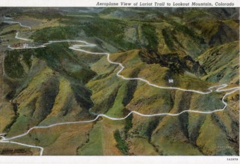 A very green aerial view of the Lariat Trail on Lookout Mountain, Colorado. Shows the M placed by Colorado School of Mines students. The M measured 80 feet high and 100 feet in width. Circa 1930-1945.