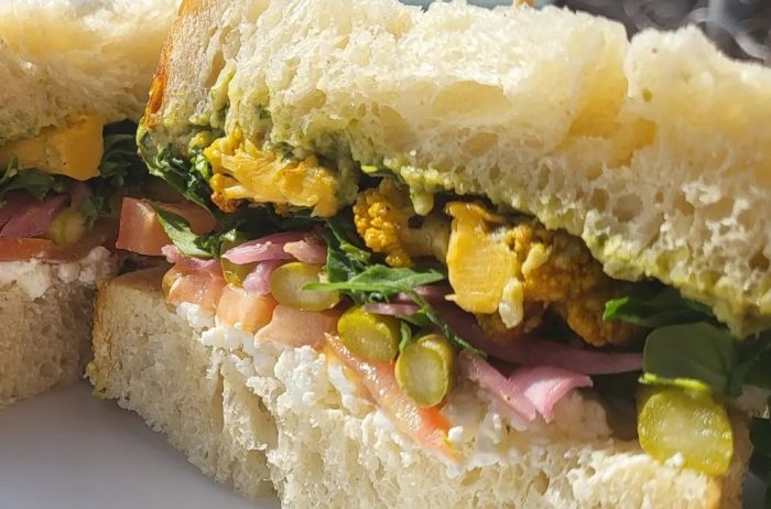 Close up of vegetable sandwich with thick, fresh, bread.
