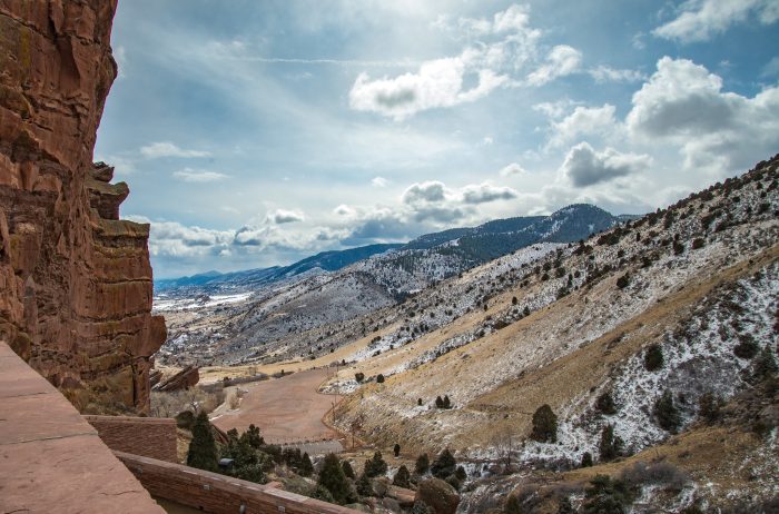 View of beautiful snowy mountains from Red Rocks Amphitheater, Morrison Colorado.
